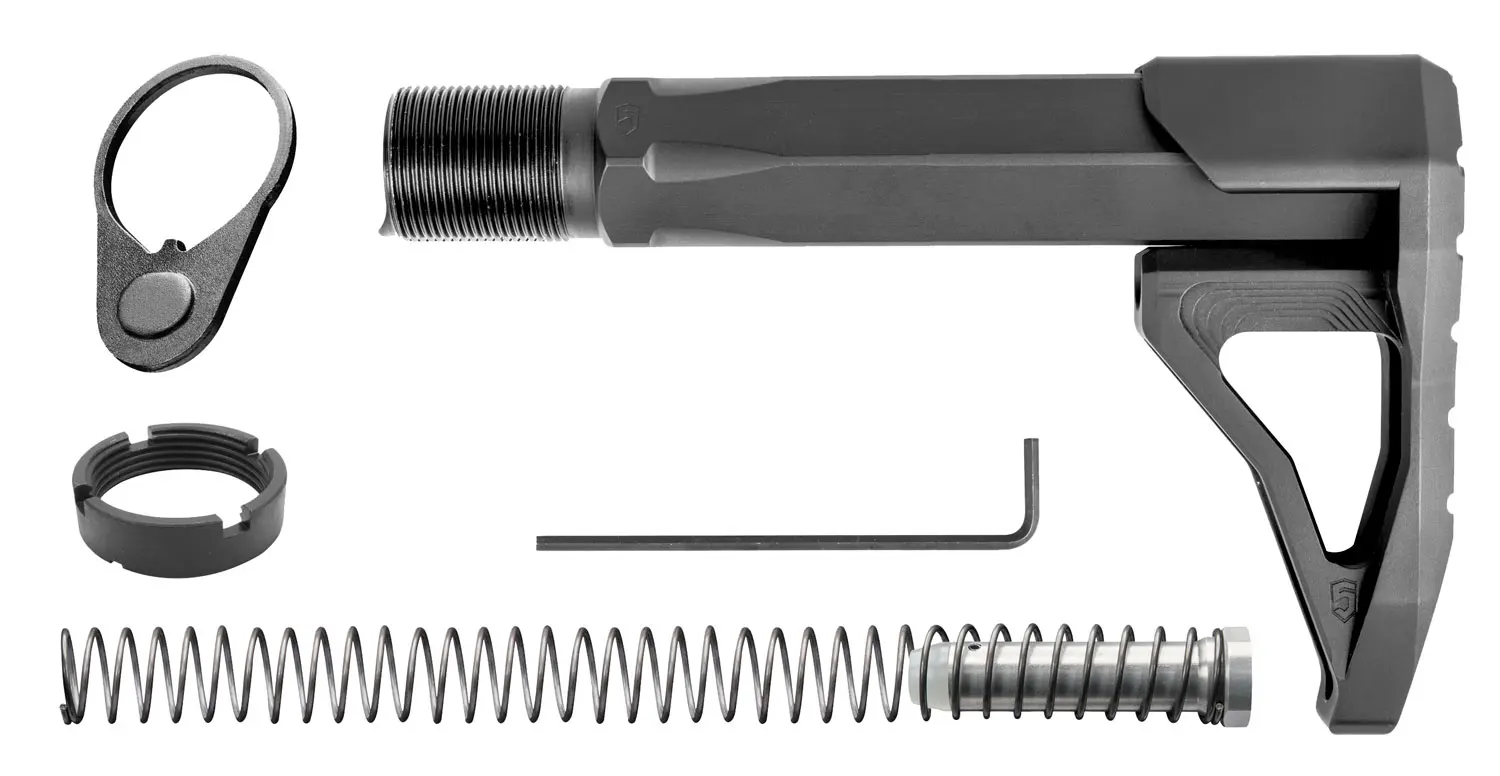 Complete rifle parts kit including bolt, spring, and tools for firearm assembly.