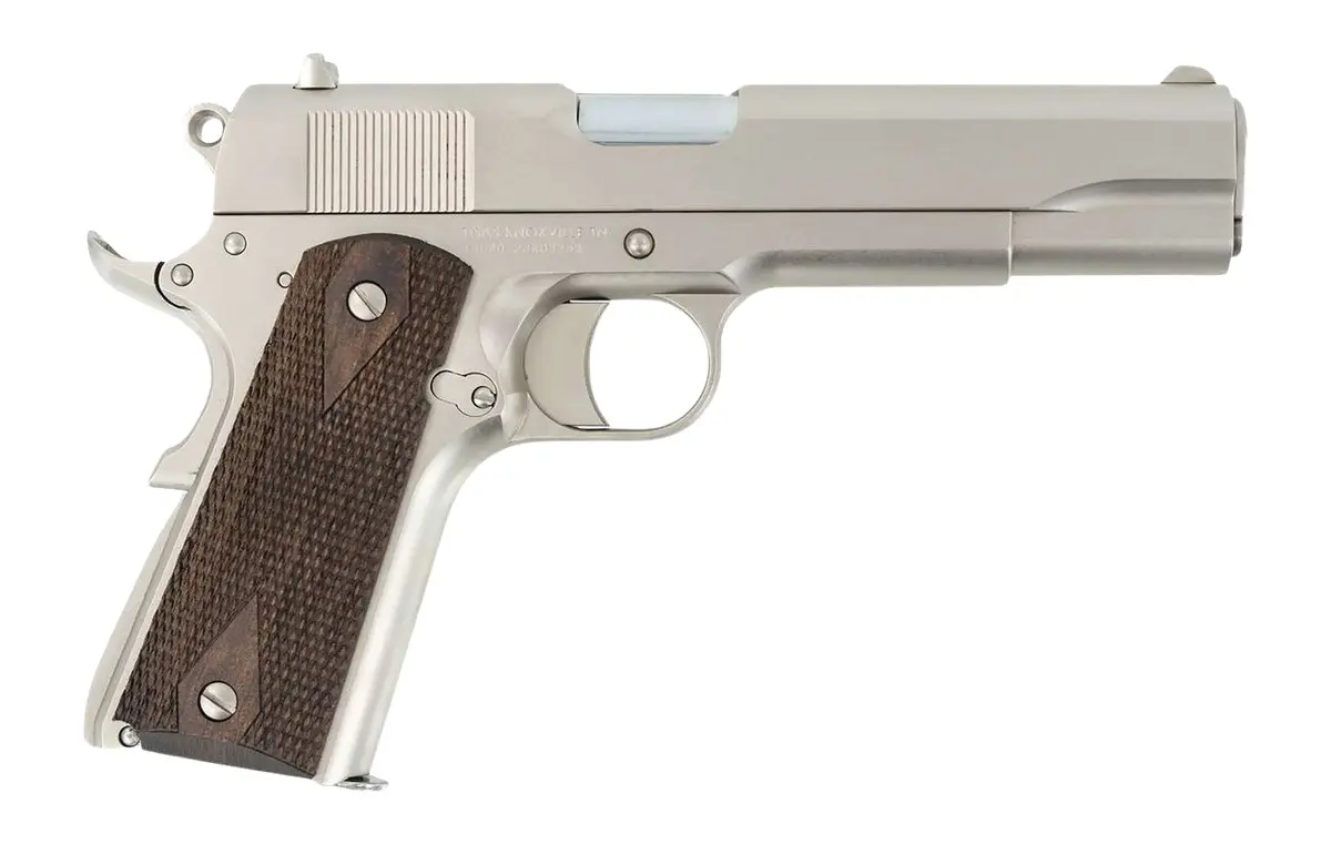 Silver handgun with wooden grip for concealed carry.