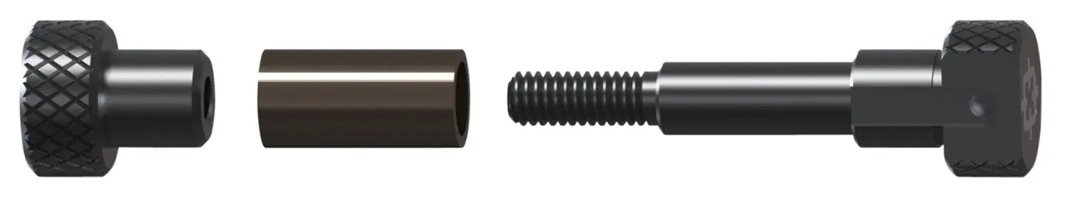 Close-up of firearm cleaning tool parts including threaded rod, handle, and attachment piece.