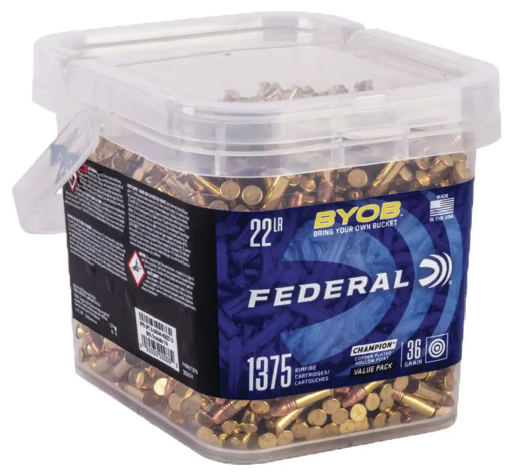 Clear plastic ammo storage box filled with brass bullets, labeled "Federal" and "BYOB" for reloading.
