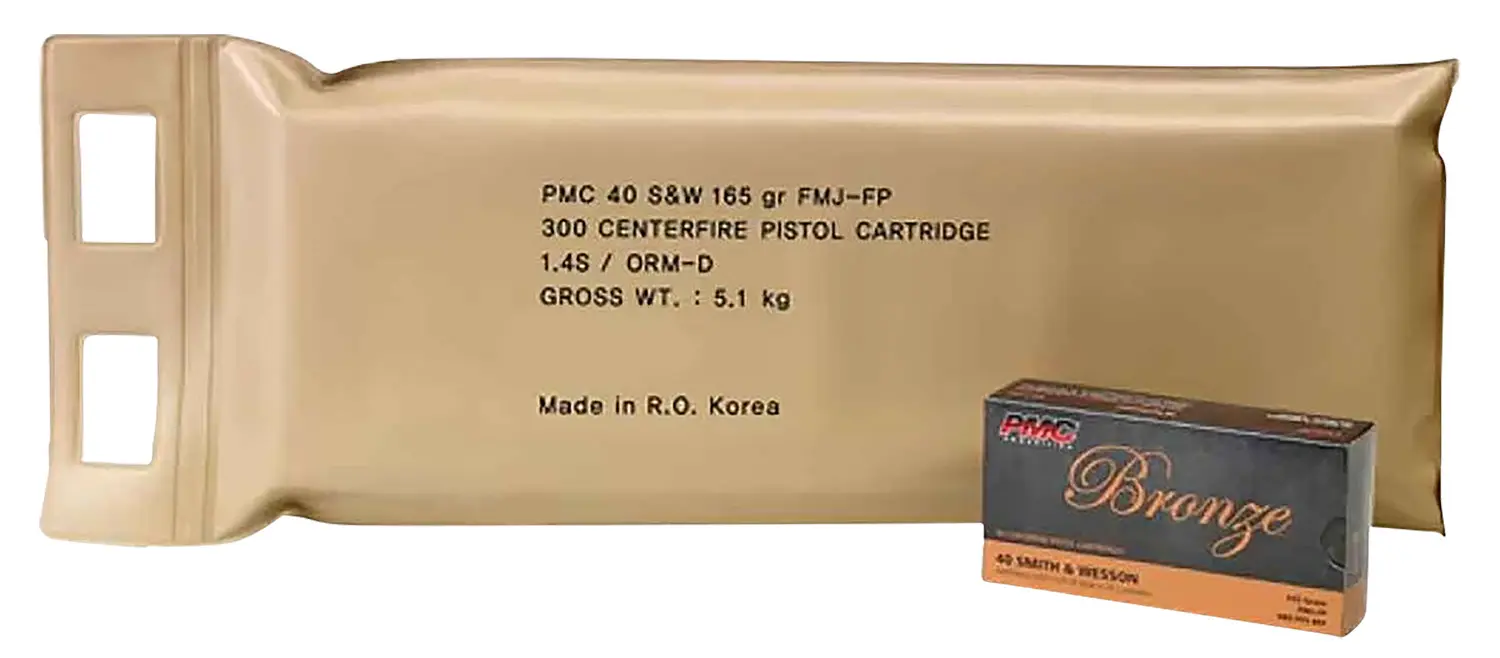 Close-up of PMC 40 S&W 165 gr FMJ-FP pistol cartridge in beige packaging with a small box of bronze.