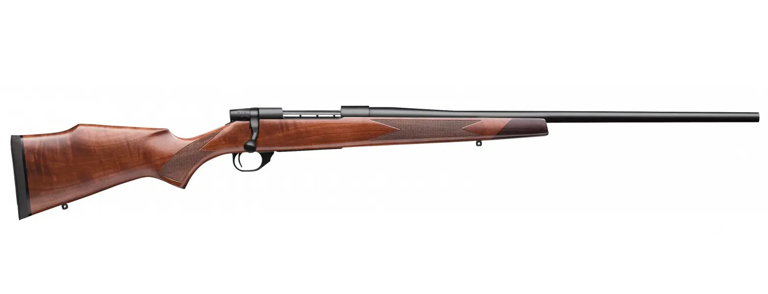 Rifle with wooden stock and long barrel, ideal for hunting and target shooting.