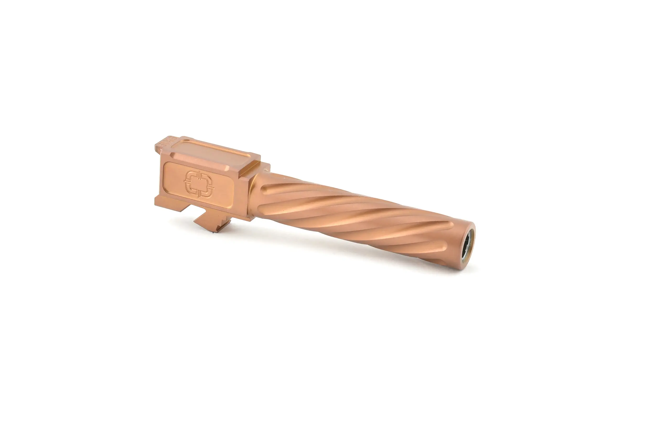 Tan-colored firearm suppressor with a textured finish.