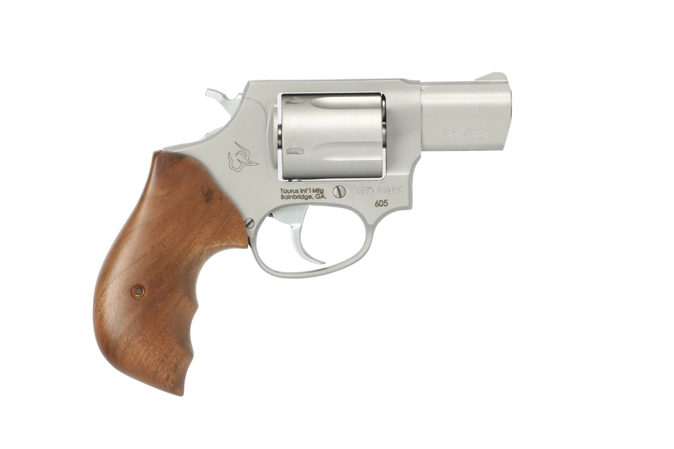 Silver revolver with wooden grip, compact firearm for self-defense.
