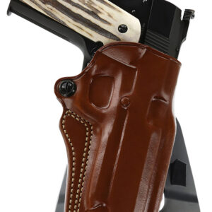 Gun with leather holster and wooden grip.