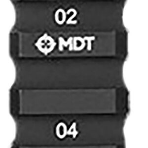 Close-up of a black firearm accessory rail section with numbered slots and MDT logo.