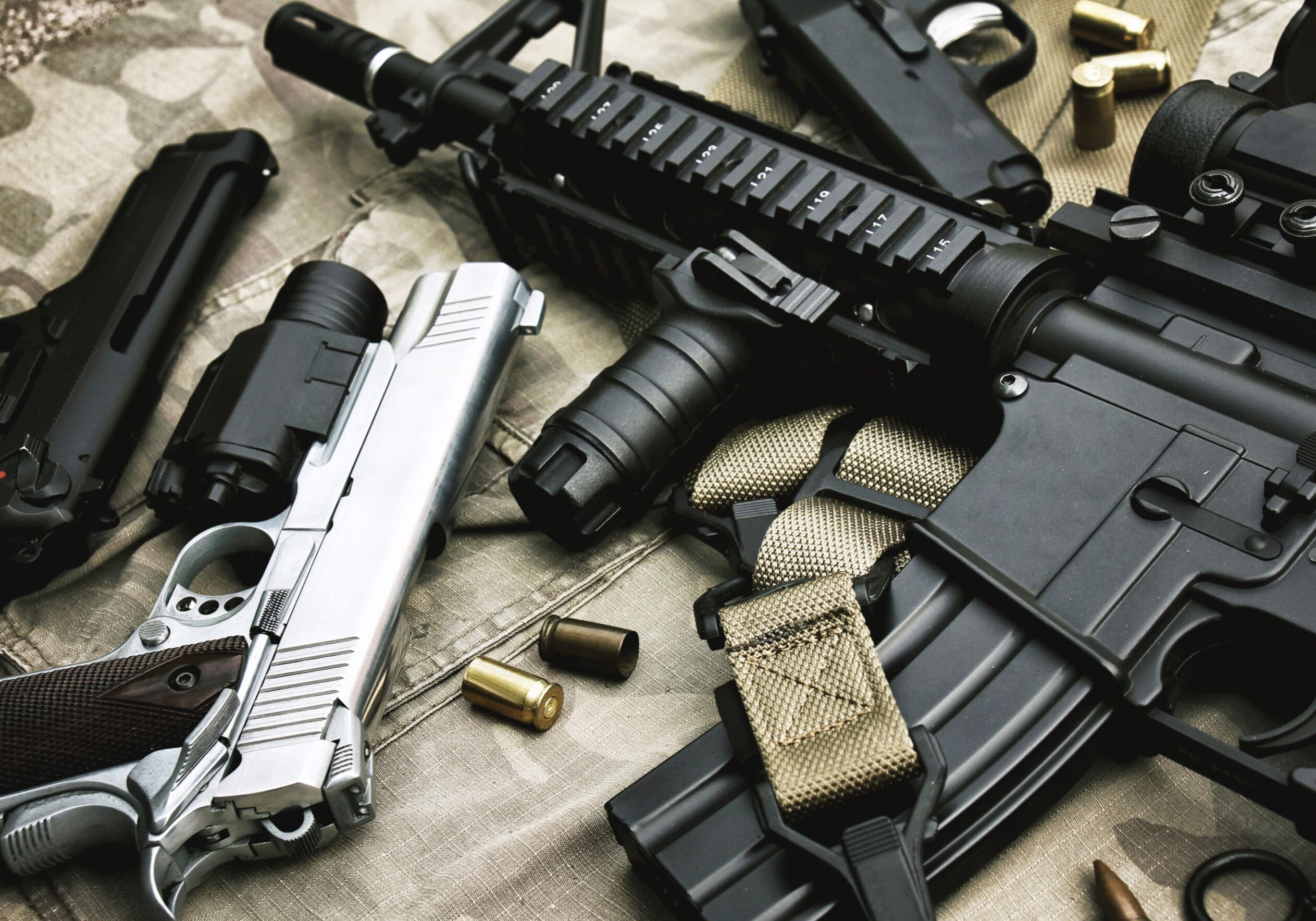 Weapons and military equipment for army, Assault rifle gun (M4A1) and pistol on camouflage background.