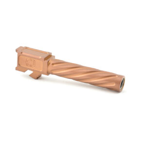 Tan-colored firearm suppressor with a textured finish.